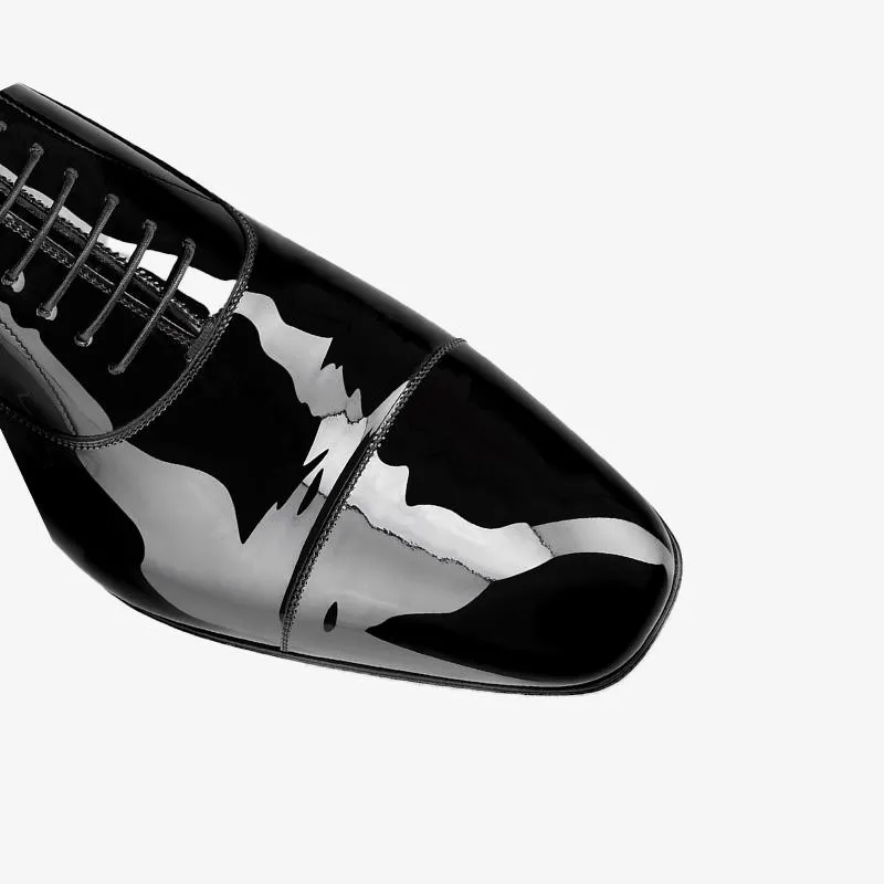 Studded Heel Leather Patent Loafer